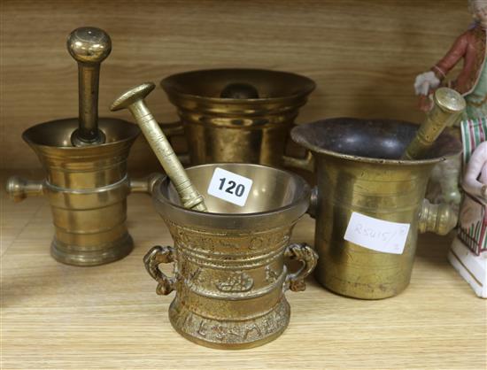 Four bronze mortars and pestles tallest 14cm